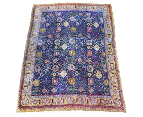 A DONEGAL CARPET  OF USHAK DESIGN  approximately 462 x 378cm   Condition Report:  Carpet with some wear overall commensurate 
