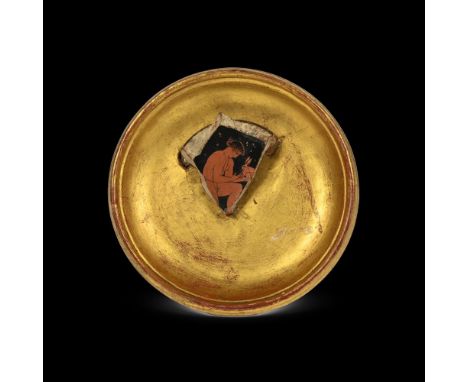 AN ATTIC RED FIGURE CUP FRAGMENT  ATTRIBUTED TO THE ERETRIA PAINTER, CIRCA 440-410 BC  Showing part of a nude youth in fine d