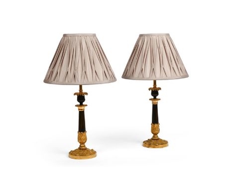 A PAIR OF FRENCH GILT AND PATINATED BRONZE TRIFORM LAMP BASES  FIRST HALF OF THE 19TH CENTURY AND LATER  Now wired, with plea