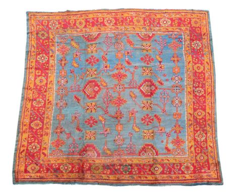 AN USHAK CARPET approximately 346 x 344cm  Condition Report:  Carpet with the wear and fading commensurate with age and use. 