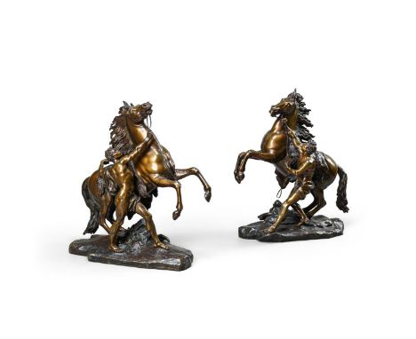 AFTER GUILLAUME COUSTOU (1677-1746), A LARGE PAIR OF BRONZE MARLY HORSES  FRENCH, LATE 19TH CENTURY  59cm high, the base 48cm