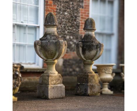 A PAIR OF CARVED BATH STONE FINIALS OF LARGE PROPORTIONS  19TH CENTURY  Of country house gate scale  each approximately 185cm