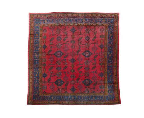 AN USHAK CARPET approximately 333 x 315cm  Condition Report:  Carpet with some wear and minor fading overall commensurate wit