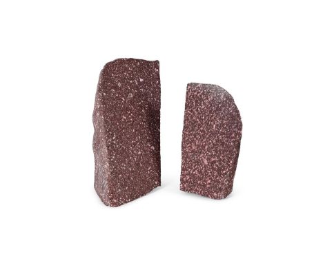 TWO IMPERIAL PORPHYRY ARCHITECTURAL FRAGMENTS  The larger example polished to one side, part finished to other, unfinished re