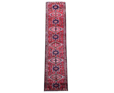A HERIZ RUNNER  Of narrow proportions approximately 387 x 73cm