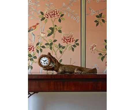 A NOVELTY GILT AND COLD PAINTED BRONZE CROCODILE CLOCK  POSSIBLY AUSTRIAN, 20TH CENTURY  The case possibly influenced by the 