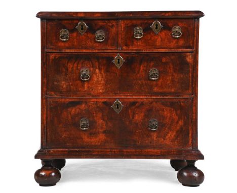 A WILLIAM & MARY WALNUT AND FEATHERBANDED CHEST OF DRAWERS CIRCA 1690  With an ivorine inventory or collection label to the r
