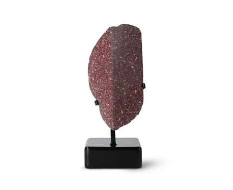 AN IMPERIAL PORPHYRY ARCHITECTURAL FRAGMENT  Polished to two sides, unfinished reverse, set on modern stand  porphyry 28cm lo