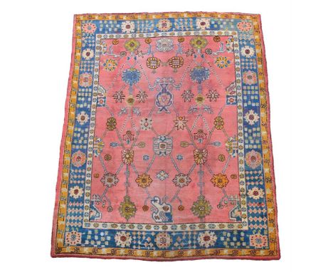 AN USHAK CARPET approximately 310 x 265cm  Condition Report:  Carpet with some wear overall consistent with age and use. Some