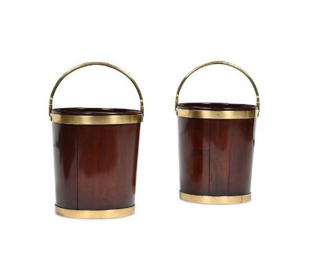 A PAIR OF GEORGE III MAHOGANY AND BRASS BOUND BUCKETS CIRCA 1770 44cm high, 38cm diameterTwo closely related pairs of buckets