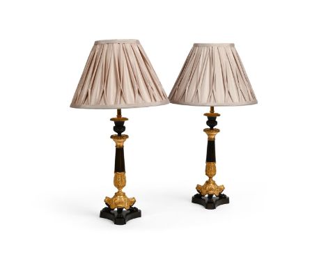A PAIR OF FRENCH GILT AND PATINATED BRONZE TRIFORM LAMP BASES  FIRST HALF OF THE 19TH CENTURY AND LATER  Now wired, with plea