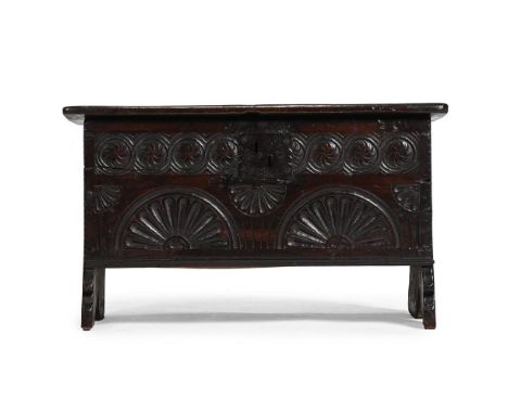 AN UNUSUAL SMALL CHARLES I OAK CARVED CHEST CIRCA 1630 40.5cm high, 71cm wide, 31.5cm deepFor a related 17th century oak ches