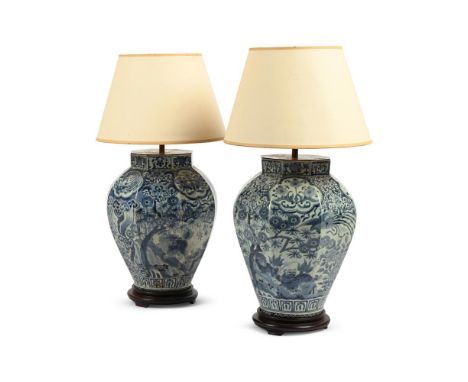 A PAIR OF JAPANESE BLUE AND WHITE ARITA VASES  LATE 17TH CENTURY  Later converted to lamps  each vase 37cm high (59cm high in