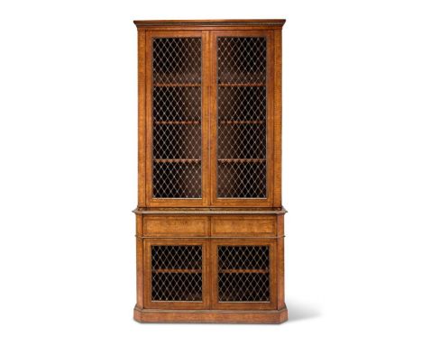 A VICTORIAN BURR WALNUT, FIGURED WALNUT AND GILT METAL MOUNTED BOOKCASE ATTRIBUTED TO MORANT, CIRCA 1860 With two pairs of br