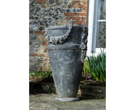 A TALL LEAD GARDEN PLANTER  19TH CENTURY  Possibly French in the Louis XVI manner with cylindrical tapering body with rich re