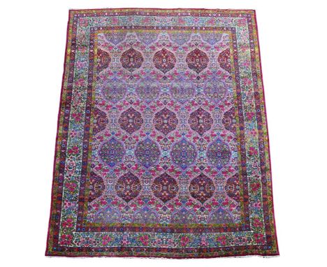A LAVAR KIRMAN CARPET  CIRCA 1920  approximately 376 x 288cm  Condition Report:  Carpet with wear overall consistent with age