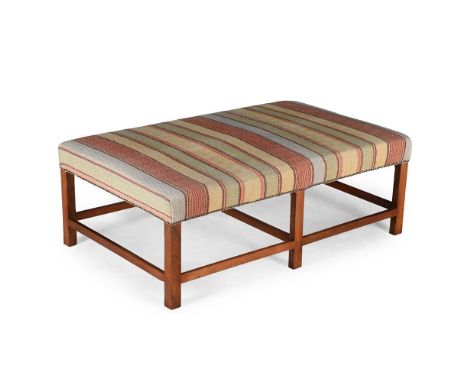 A WALNUT AND ROBERT KIME UPHOLSTERED LONG STOOL IN GEORGE III STYLE, OF RECENT MANUFACTURE Upholstered in Robert Kime Ltd. 'S