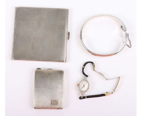 Two early 20th century silver cigarette boxes with engine turned decoration, with a silver bangle and Accurist cocktail watch