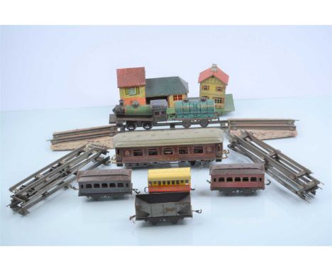 An assortment of Bing and other 0 Gauge Trains and Accessories (qty), an early Bing continental 0-4-0 loco, with red 2nd clas