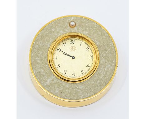 A Mikimoto International travel clock, comprising a gold tone round dial, with number markers, Mikimoto signature logo, with 
