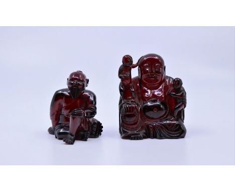 A Chinese amber model of buddha and a similar Japanese amber carving&nbsp;