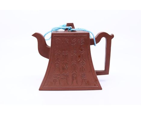 A Chinese Yixing teapot with caliigraphy decoration