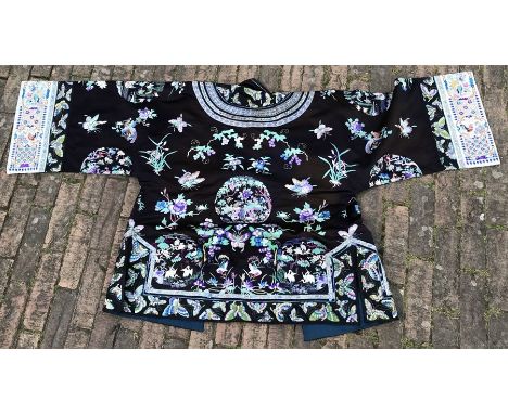 A Chinese short ceremonial robe / jacket, black silk ground embroidered with butterflies to collar and border panels, the fro