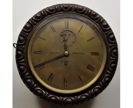 A scarce mid 19th century circular Marine oak cased wall clock, the brass dial with Roman numeral chapter ring and marked "Wa