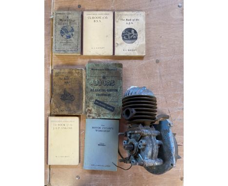 A Jap engine plus assorted motorcycle books.
