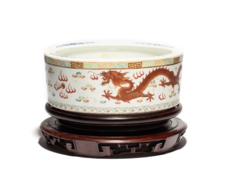 A CHINESE FAMILLE ROSE JARDINIERE, GUANGXU MARK AND PERIOD (1875-1908) low cylindrical, the exterior painted with two gilt de