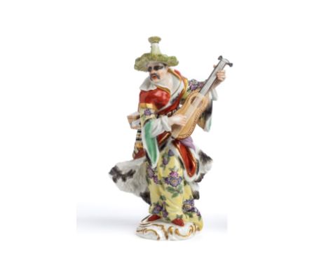 A MEISSEN OUTSIDE DECORATED FIGURE OF A MALE "MALABAR MUSICIAN", 20TH CENTURY after a mid 18th century model by Friedrich Eli