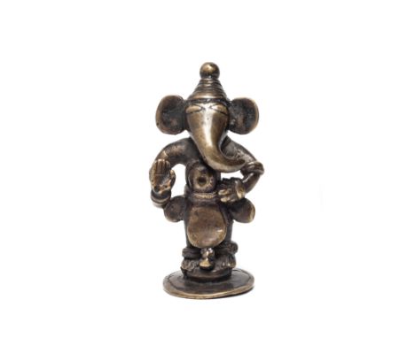 AN UNUSUAL STANDING FIGURE OF GANESHA, EASTERN INDIA, CIRCA 18TH CENTURY the elephant headed deity standing on circular base,
