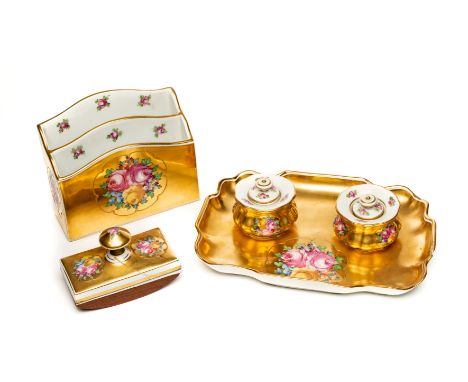 A "VIENNA" STYLE PORCELAIN DESK SET, CIRCA 1900 each piece painted with flower groups on a solid gold ground, comprising a sh