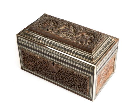 ˜AN ANGLO-INDIAN TEA-CADDY, BOMBAY, INDIA, CIRCA 1880 decorated with carved wood figural and foliate panels with sadeli work 