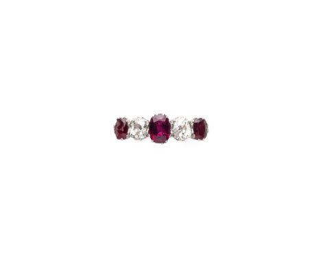 [GP] RUBY AND DIAMOND FIVE STONE RING set to the centre with an oval ruby with cushion shaped diamonds and an oval ruby on ei