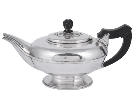 A GEORGE V SILVER TEAPOT, DAVID T. DAVIES, LONDON, 1931 planished oval, on short pedestal foot, with bold angular girdle, the