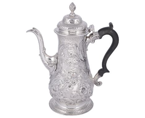 [GP] A GEORGE III AND LATER CHASED SILVER COFFEE POT, WILLIAM GRUNDY, LONDON, 1764 the baluster body chased all over with Roc