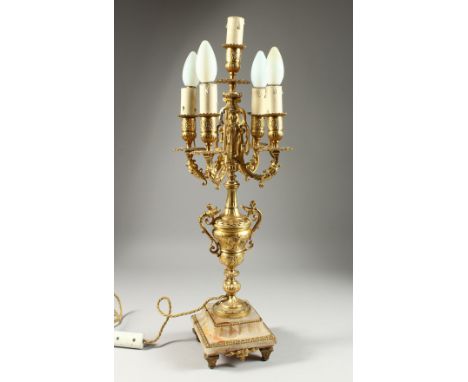 A 19TH CENTURY ONYX AND GILT METAL FIVE LIGHT CANDLELABRA on a square stepped base.