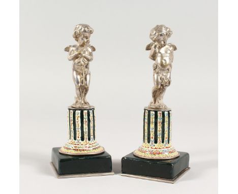 A SUPERB SMALL PAIR OF SILVERED BRONZE AND ENAMEL CUPIDS ON STANDS 6Ins high