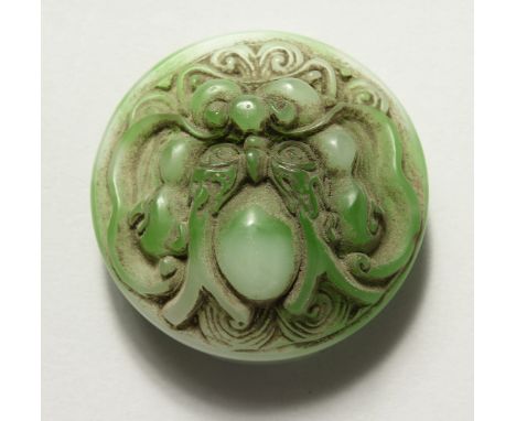 A CHINESE CIRCULAR CARVE JADE BELT BUCKLE. 2.25ins diameter.
