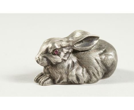 A SMALL RUSSIAN SILVER RABBIT with ruby eyes, stamped head, '84 Faberge'