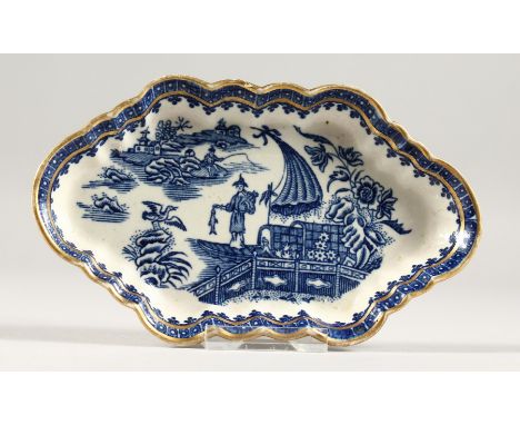 A CAUGHLEY BLUE AND WHITE SHAPED OVAL WILLOW PATTERN SPOON TRAY. Crescent mark in blue.  6ins long. 