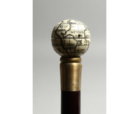 A BONE WALKING STICK ' GLOBE AND COMPASS'