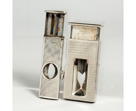 TWO ENGINE TURNED CIGAR CUTTERS