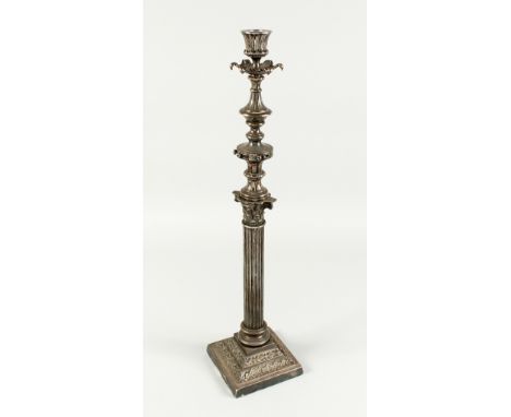 A LARGE VICTORIAN CORINTHIAN COLUMN LAMP on a square base. 23ins high.