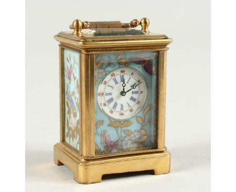 A MINIATURE SEVRES CARRIAGE CLOCK with flora porcelain panels. 2.25ins high.
