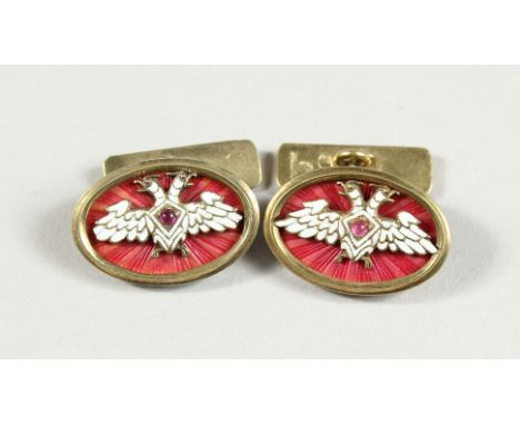 A PAIR OF RUSSIAN AND ENAMEL CUFF LINKS with Faberge mark.
