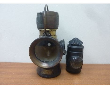 Lucas no. 632 "King of the Road" paraffin lamp together with a small tinplate candle powered hand lamp. (2)
