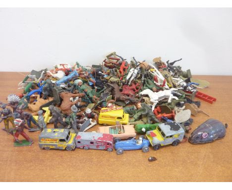 Various die-cast vehicles, lead cowboy and Indians and a quantity of plastic army and other figures.