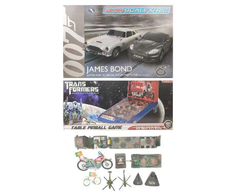 Micro Scalextric James Bond Set Transformers table pinball etc A boxed micro-scalextric James Bond Aston Martin DB5 and DBS A